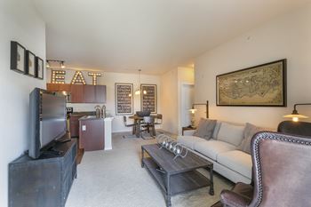 A living room with a couch, a television, and a coffee table.